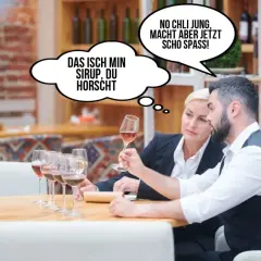 Zwei Personen probieren Wein. Eine denkt: "Das isch min Sirup, du horscht." Die andere: "No chli jung, macht aber jetz scho spass!" Lustig, wie sie den Wein beschreiben.